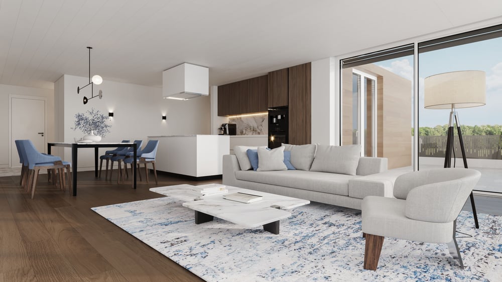 Wohnküche mit grauem Sofa und blauen Stühlen