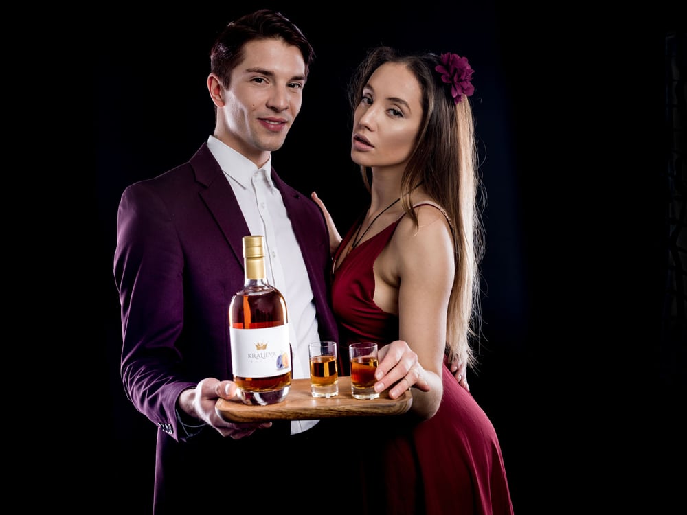 young couple with kraljeva rakija