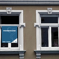 Vermietungsschild „Wohnparadies“