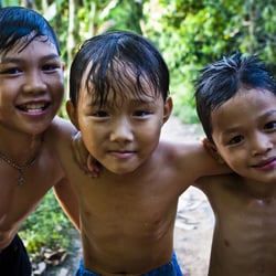 Local boys after swimming in a stream on the Mekong Delta