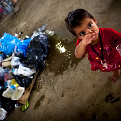 refugee kid in a shabby illegal refugee camp