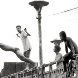Youngsters jumping from an old Chinese Bridge – Ho-Chi-Minh-City/Saigon – Vietnam