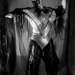 Nomi in StoneAge, performance costume