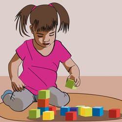 Mädchen beim Spielen mit Klötzchen