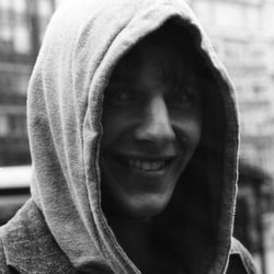 A YOUNG MAN WITH A HOOD