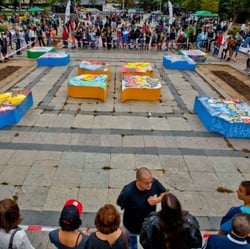 Platforms in public space with the shape of the logo