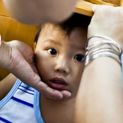 A child being measured at a health clinic sponsored by UNICEF