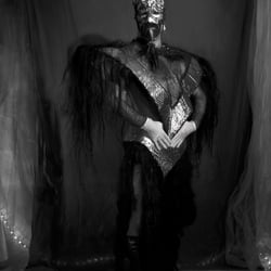 Nomi in StoneAge, performance costume