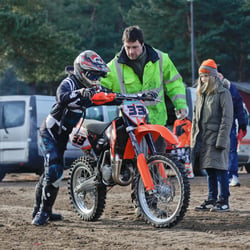 Amanda with her syster and her father/coach and mechanic at the racing track