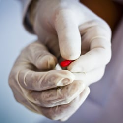 Doctors with vitamin supplements at a health clinic sponsored by UNICEF