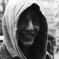 A YOUNG MAN WITH A HOOD
