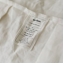 Nju Linen Branding – Textilkennzeichnung mit Logo